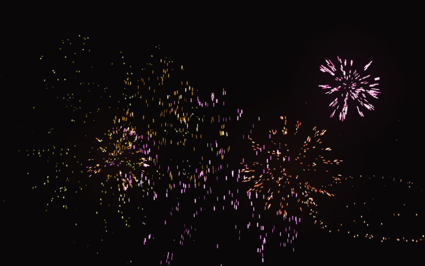 hueprism Fireworks 테마 — 검은 화면에 분홍·주황·연두색 불꽃이 터져 흩날리는 가로 화면